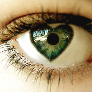 Picture of an green Eye with the Iris of the eye in the shape of a heart