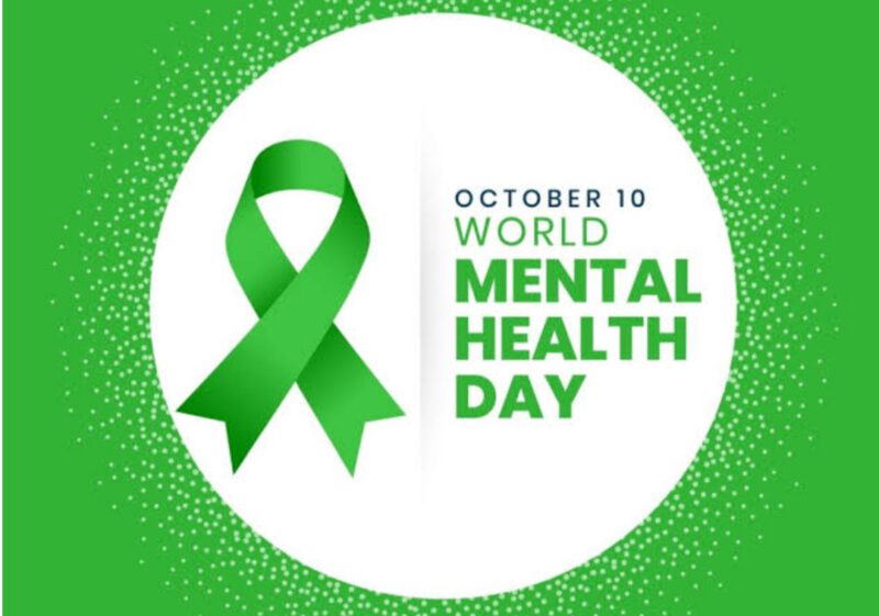 has a green background and a white circle in the middle, there is a green ribbon and the words October 10 World Mental Health Day