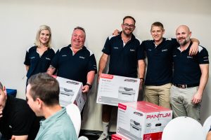 A group photo of one of the teams receiving their prize, picture with Retina Head of Special Events Linsay Engelbrecht