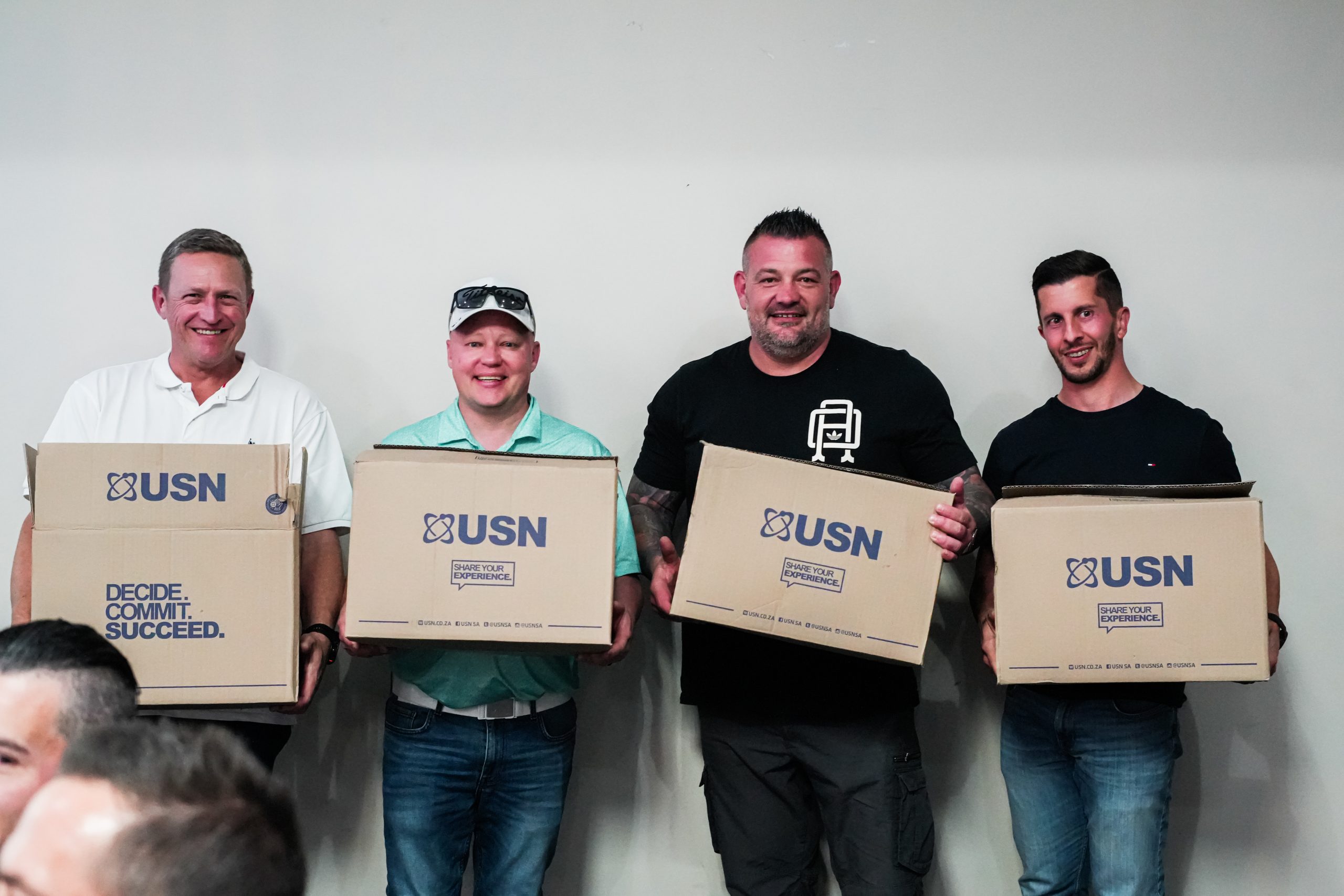 Group photo of one of the teams holding their prize 