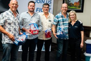 A group photo of one of the teams receiving their prize