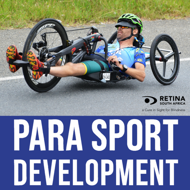 A para-athlete in a recumbent handcycle races along a paved road, wearing a helmet, sunglasses, and sports gear. The background shows grass and a blurred roadside. The includes the Retina South Africa logo with the tagline “a Cure in Sight for Blindness,” and bold text at the bottom reads “PARA SPORT DEVELOPMENT.”