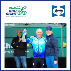 Larry standing on stage with Linsay at the prize giving