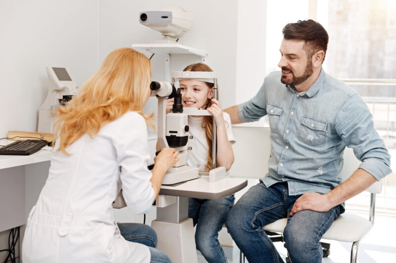 ophthalmologist with young patient
