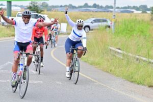 cyclists coming across the finish line