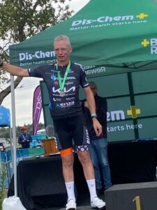 Cyclist accepting award on second place podium